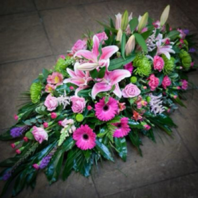 Casket spray - bright - Incorporating seasonal flowers to a colour palette of your choosing.
