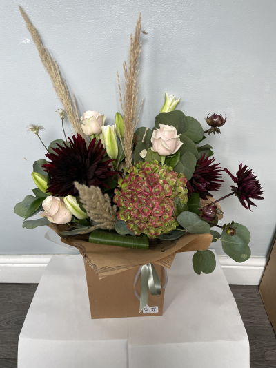 Rustic Romance - A striking arrangement combining soft romantic shades with deep, dramatic tones and natural textures. Its relaxed, contemporary style makes it a wonderful gift for someone who loves something a little different.